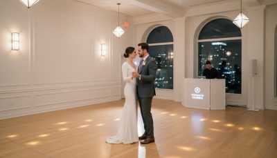 Bride and groom dancing at Toronto wedding with elegant DJ setup.