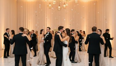 Couples dancing at a wedding reception with a minimalist background.