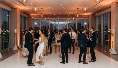 Guests dancing at a Toronto wedding reception with warm lighting.